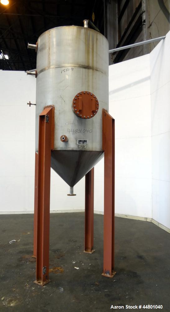 Used Par Piping & Fabrication Tank, 575 Gallon, 321 Stainless Steel, Vertical. 48" Diameter x 72" straight side, coned top & bottom. Openings top 3", 8", 1"; side (2) 2", 12" with cover. 2" Center bo...