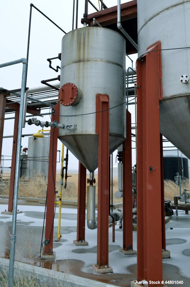 Used Par Piping & Fabrication Tank, 575 Gallon, 321 Stainless Steel, Vertical. 48" Diameter x 72" straight side, coned top & bottom. Openings top 3", 8", 1"; side (2) 2", 12" with cover. 2" Center bo...
