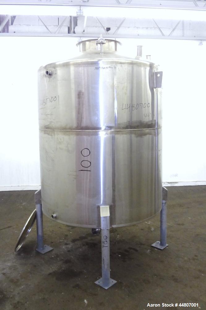 Used Tank, 575 Gallon, 316 Stainless Steel, Vertical. Approximate 54" diameter x 58" straight side, dished top, coned bottom. Openings top (2)1", (2) 2", 3", 19" man way with cover. 2" Center bottom ...