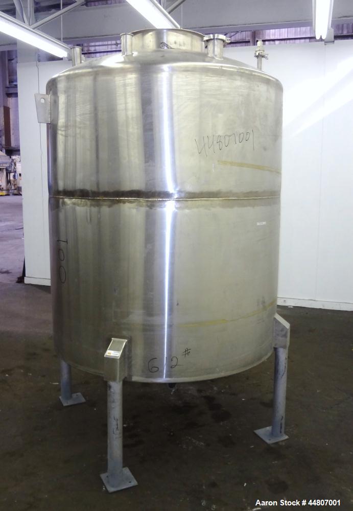 Used Tank, 575 Gallon, 316 Stainless Steel, Vertical. Approximate 54" diameter x 58" straight side, dished top, coned bottom. Openings top (2)1", (2) 2", 3", 19" man way with cover. 2" Center bottom ...