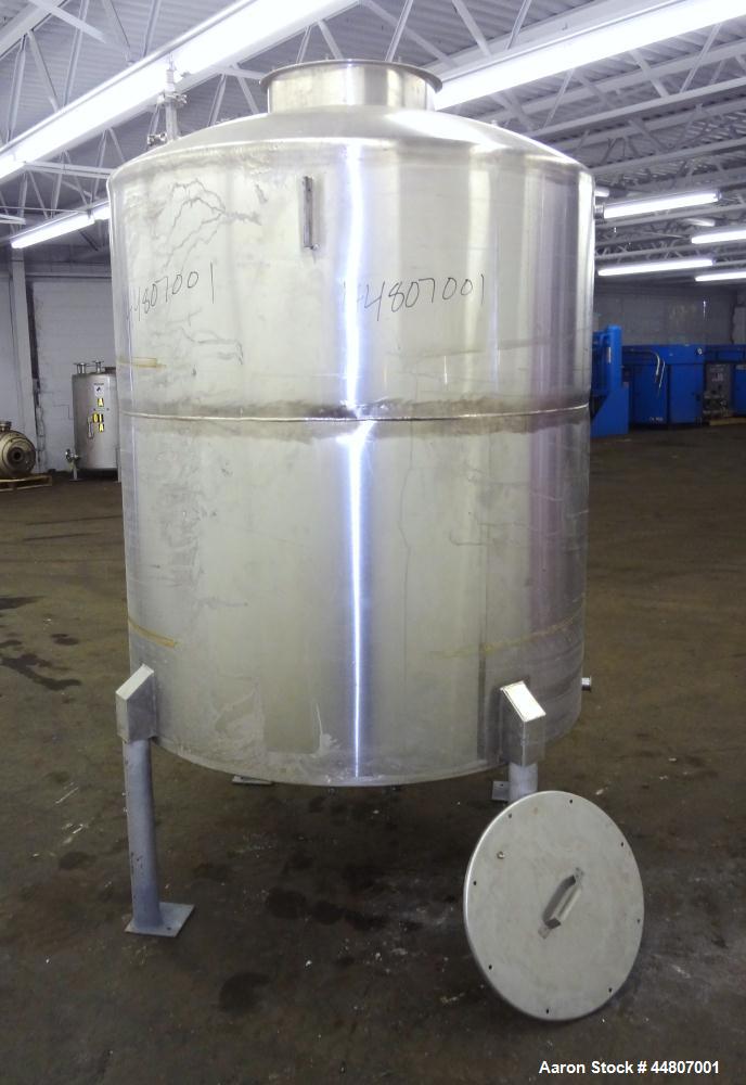 Used Tank, 575 Gallon, 316 Stainless Steel, Vertical. Approximate 54" diameter x 58" straight side, dished top, coned bottom. Openings top (2)1", (2) 2", 3", 19" man way with cover. 2" Center bottom ...