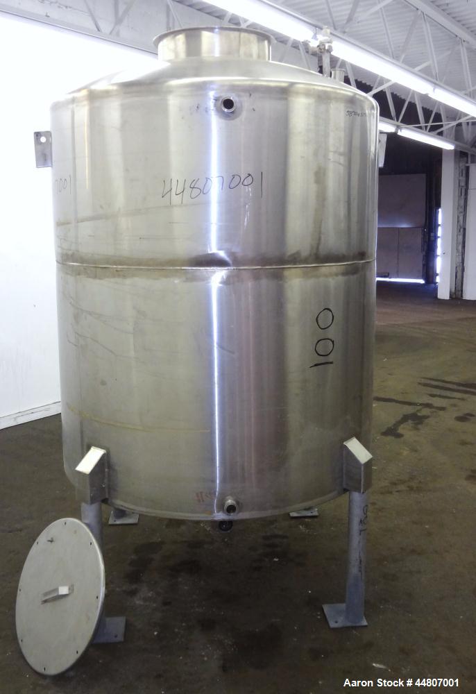 Used Tank, 575 Gallon, 316 Stainless Steel, Vertical. Approximate 54" diameter x 58" straight side, dished top, coned bottom. Openings top (2)1", (2) 2", 3", 19" man way with cover. 2" Center bottom ...