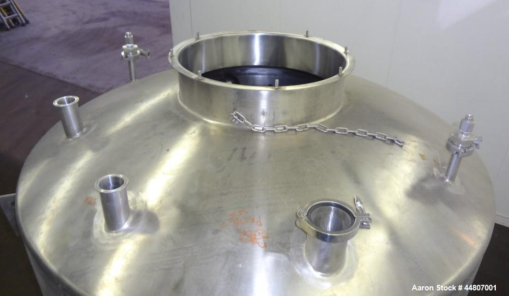Used Tank, 575 Gallon, 316 Stainless Steel, Vertical. Approximate 54" diameter x 58" straight side, dished top, coned bottom. Openings top (2)1", (2) 2", 3", 19" man way with cover. 2" Center bottom ...