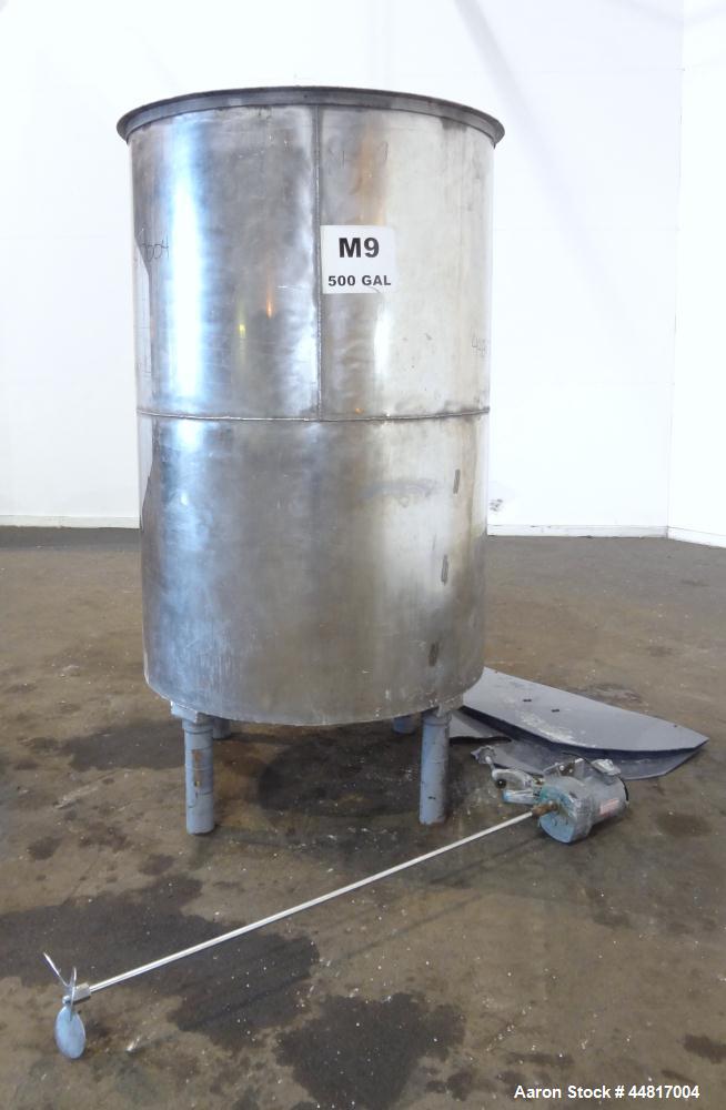 Used Tank, 550 Gallons, 304 Stainless Steel, Vertical. Approximately 48" diameter x 72" straight side. Flat open top with a plastic cover, coned bottom. Top entering clamp on agitator, 3/4" diameter ...
