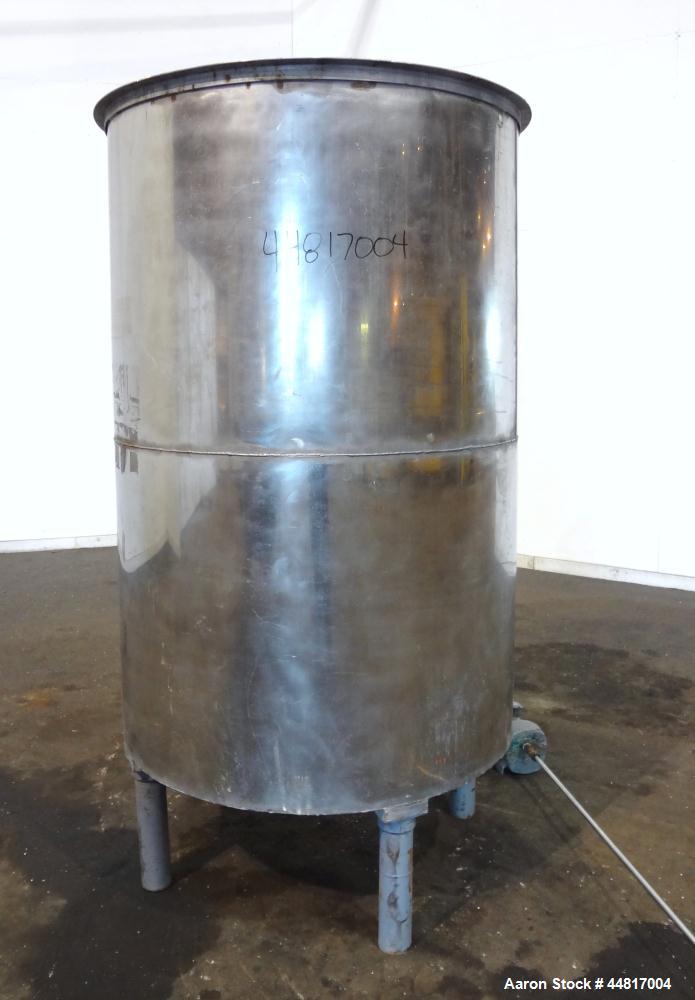 Used Tank, 550 Gallons, 304 Stainless Steel, Vertical. Approximately 48" diameter x 72" straight side. Flat open top with a plastic cover, coned bottom. Top entering clamp on agitator, 3/4" diameter ...