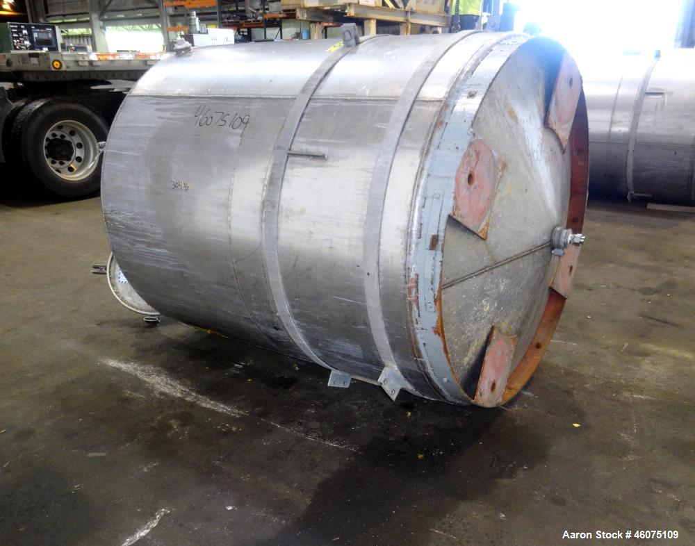 Used Tank, Approximate 650 Gallon, 304 Stainless Steel, Vertical. Approximate 55" diameter x 59" straight side, coned top & bottom. Openings Top: 20" man way with hinged cover, (4) 2", (3) 1". Side: ...