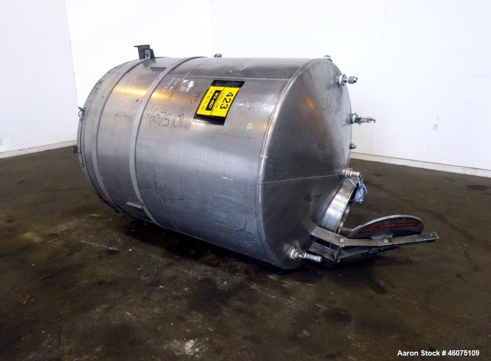 Used Tank, Approximate 650 Gallon, 304 Stainless Steel, Vertical. Approximate 55" diameter x 59" straight side, coned top & bottom. Openings Top: 20" man way with hinged cover, (4) 2", (3) 1". Side: ...