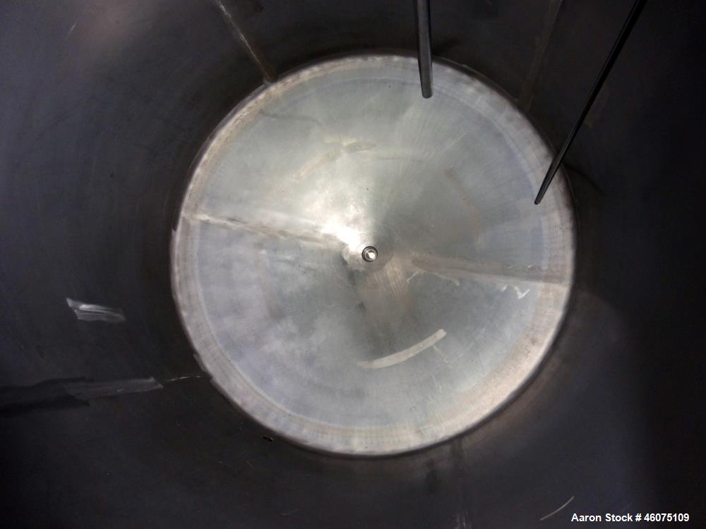Used Tank, Approximate 650 Gallon, 304 Stainless Steel, Vertical. Approximate 55" diameter x 59" straight side, coned top & bottom. Openings Top: 20" man way with hinged cover, (4) 2", (3) 1". Side: ...