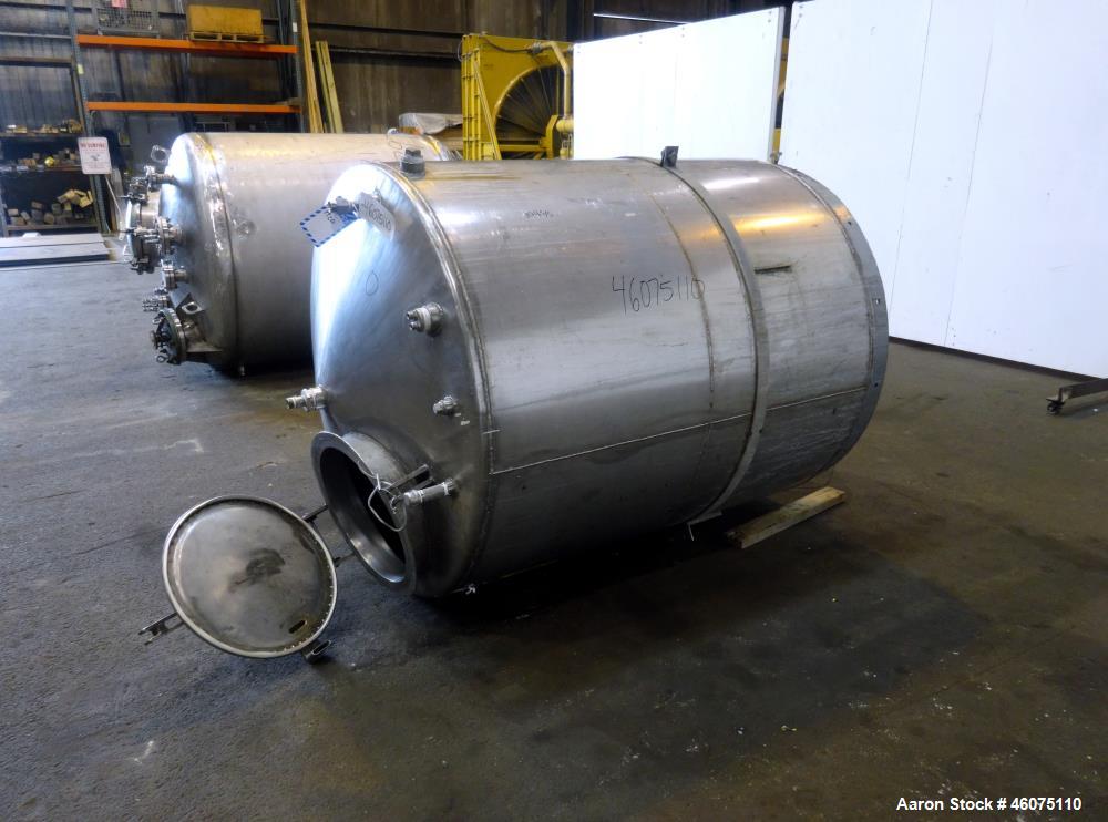 Used Tank, Approximate 650 Gallon, 304 Stainless Steel, Vertical. Approximate 55" diameter x 58" straight side, coned top & bottom. Openings top: 20" man way with hinged cover, (4) 2", (3) 1". Side: ...