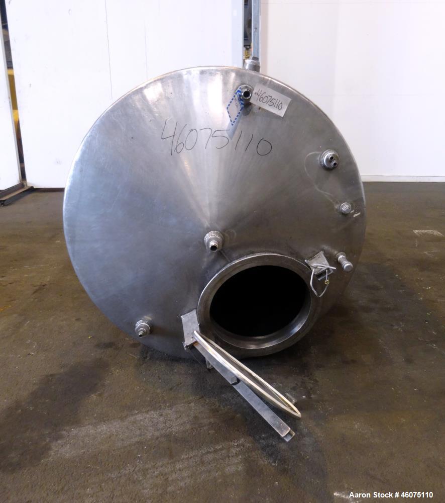 Used Tank, Approximate 650 Gallon, 304 Stainless Steel, Vertical. Approximate 55" diameter x 58" straight side, coned top & bottom. Openings top: 20" man way with hinged cover, (4) 2", (3) 1". Side: ...