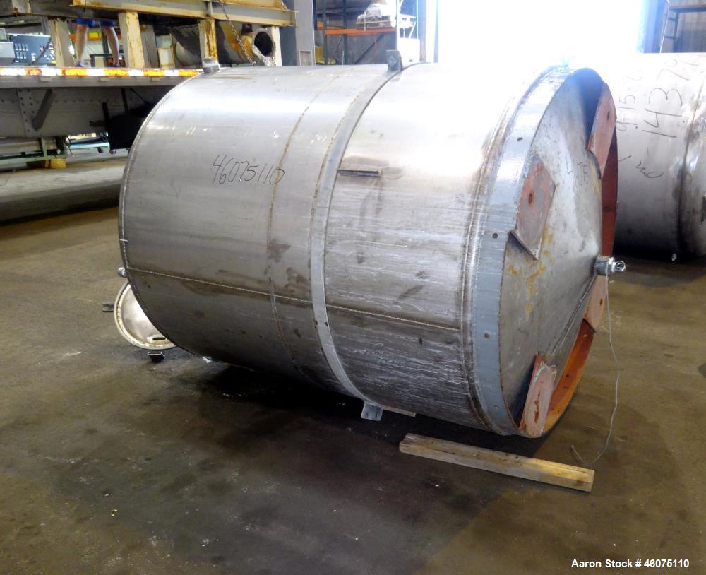 Used Tank, Approximate 650 Gallon, 304 Stainless Steel, Vertical. Approximate 55" diameter x 58" straight side, coned top & bottom. Openings top: 20" man way with hinged cover, (4) 2", (3) 1". Side: ...