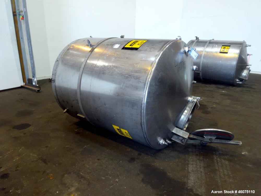 Used Tank, Approximate 650 Gallon, 304 Stainless Steel, Vertical. Approximate 55" diameter x 58" straight side, coned top & bottom. Openings top: 20" man way with hinged cover, (4) 2", (3) 1". Side: ...