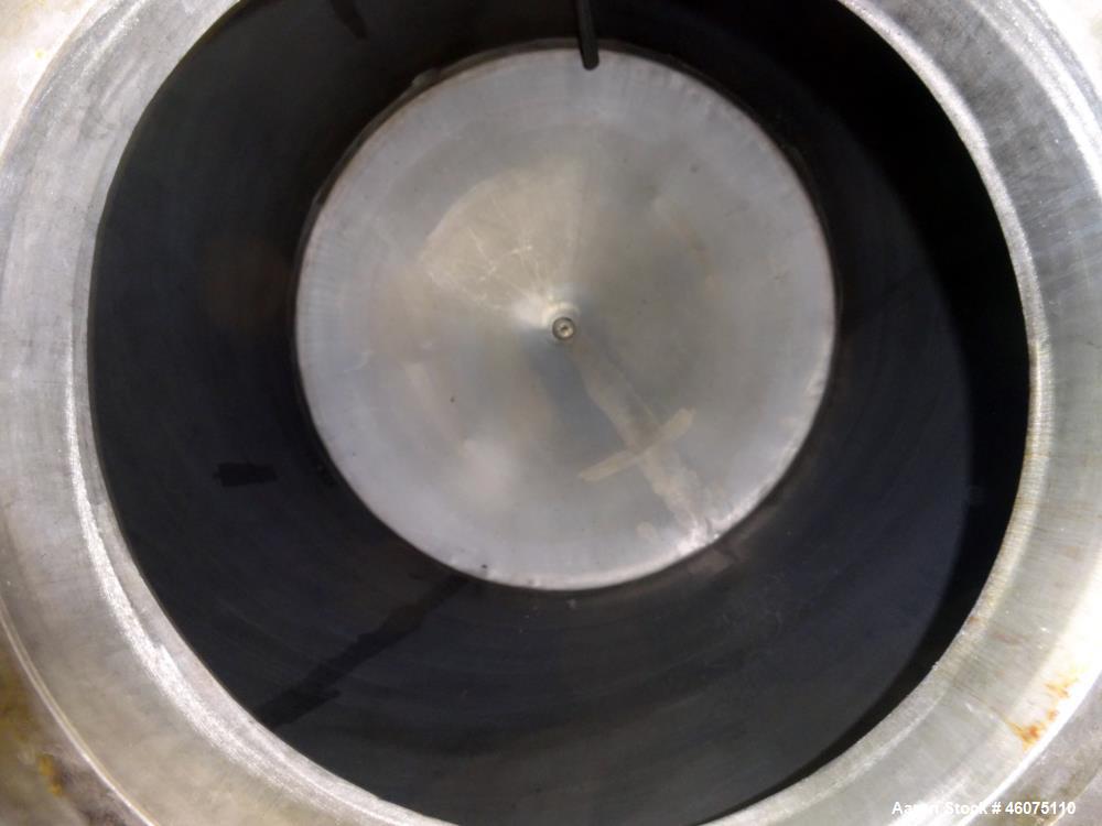 Used Tank, Approximate 650 Gallon, 304 Stainless Steel, Vertical. Approximate 55" diameter x 58" straight side, coned top & bottom. Openings top: 20" man way with hinged cover, (4) 2", (3) 1". Side: ...