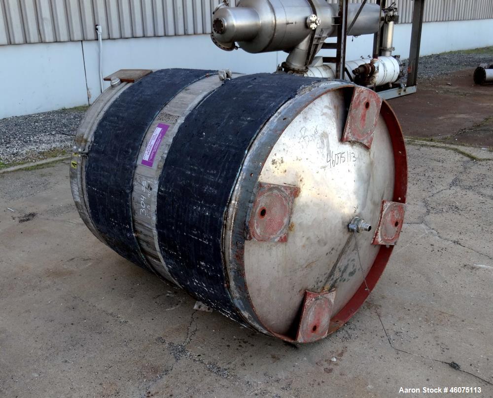 Used Tank, 650 Gallon, 304 Stainless Steel, Vertical. Approximate 52" diameter x 60" straight side, coned top & bottom. Openings top 17-3/4" man way with hinged cover, (4) 2" threaded, 2" center bott...