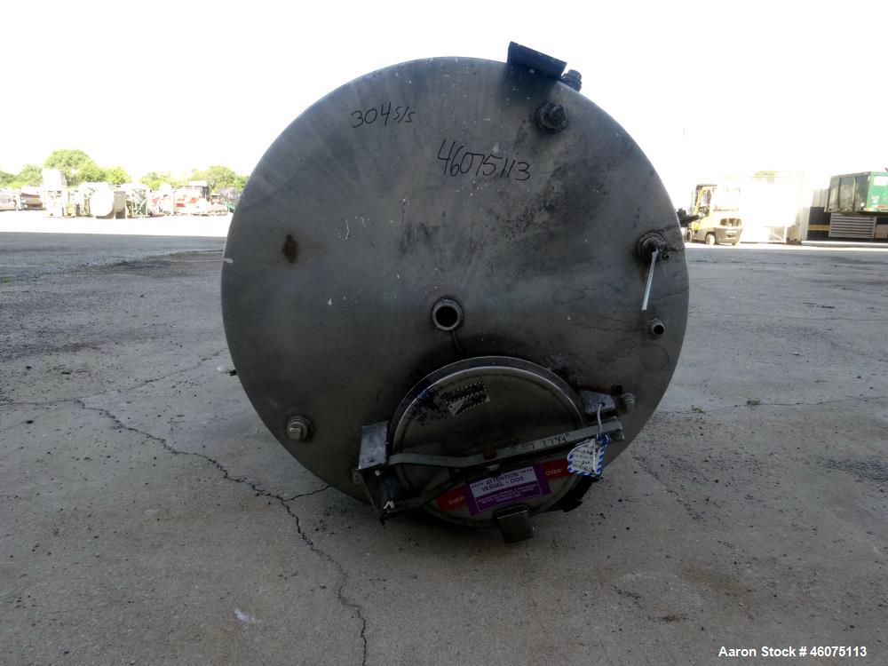 Used Tank, 650 Gallon, 304 Stainless Steel, Vertical. Approximate 52" diameter x 60" straight side, coned top & bottom. Openings top 17-3/4" man way with hinged cover, (4) 2" threaded, 2" center bott...