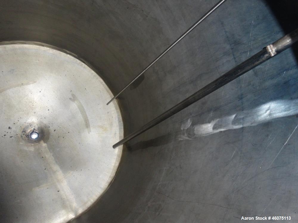 Used Tank, 650 Gallon, 304 Stainless Steel, Vertical. Approximate 52" diameter x 60" straight side, coned top & bottom. Openings top 17-3/4" man way with hinged cover, (4) 2" threaded, 2" center bott...