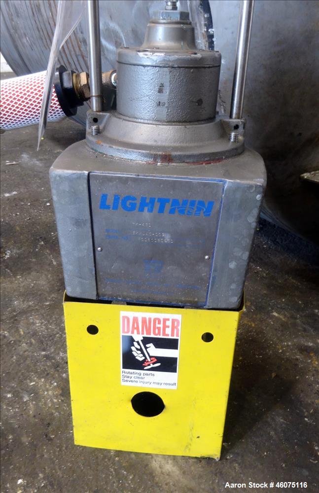 Used Tank, 500 Gallon, 304 Stainless Steel, Vertical. Approximate 48" diameter x 60" straight side, dished top and bottom. Off center top entering air operated Lightnin agitator, model EKXJAC-100, se...