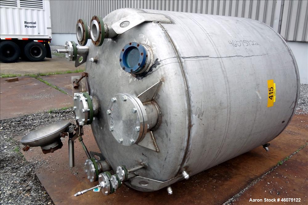Used Tank, 975 Gallon, 316 Stainless Steel, Vertical. Approximate 66" diameter x 60" Straight side, dished top/bottom. Top openings: (3) 4", (2) 3", (20) 1", 6", 6" sight glass, 8", 20" man way with ...