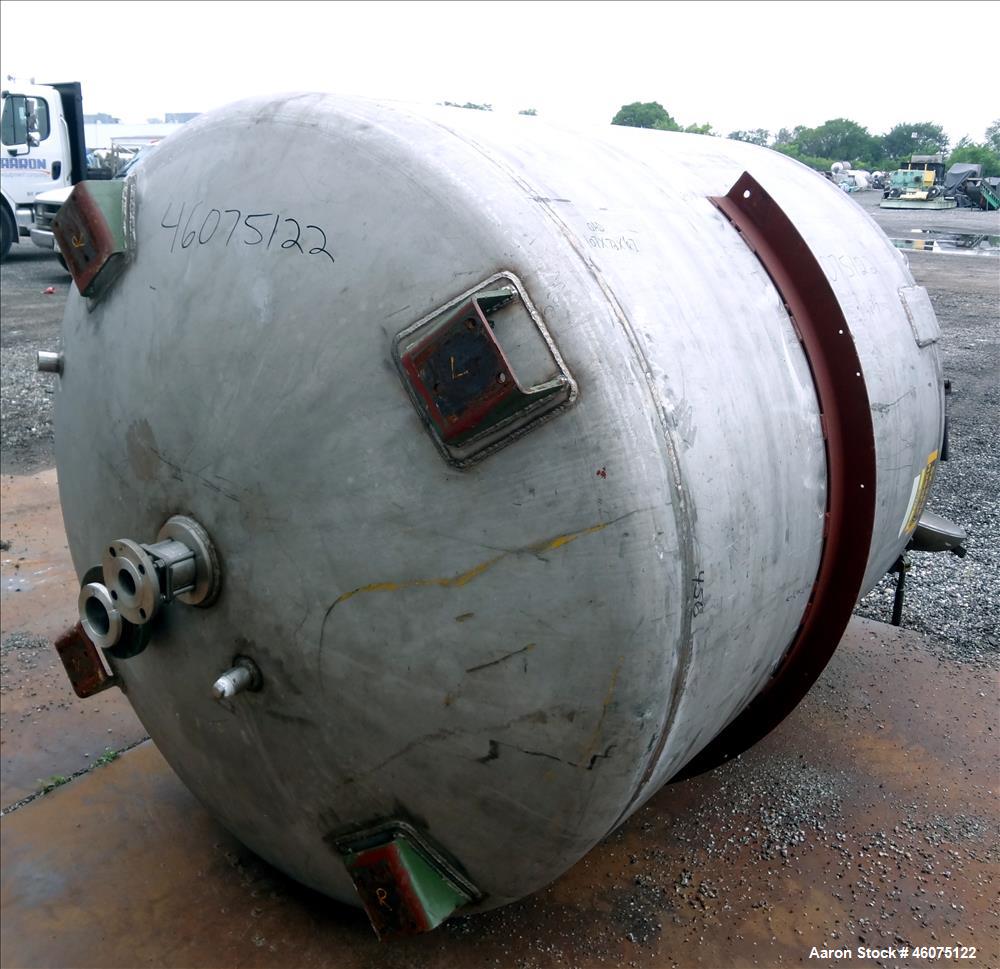 Used Tank, 975 Gallon, 316 Stainless Steel, Vertical. Approximate 66" diameter x 60" Straight side, dished top/bottom. Top openings: (3) 4", (2) 3", (20) 1", 6", 6" sight glass, 8", 20" man way with ...