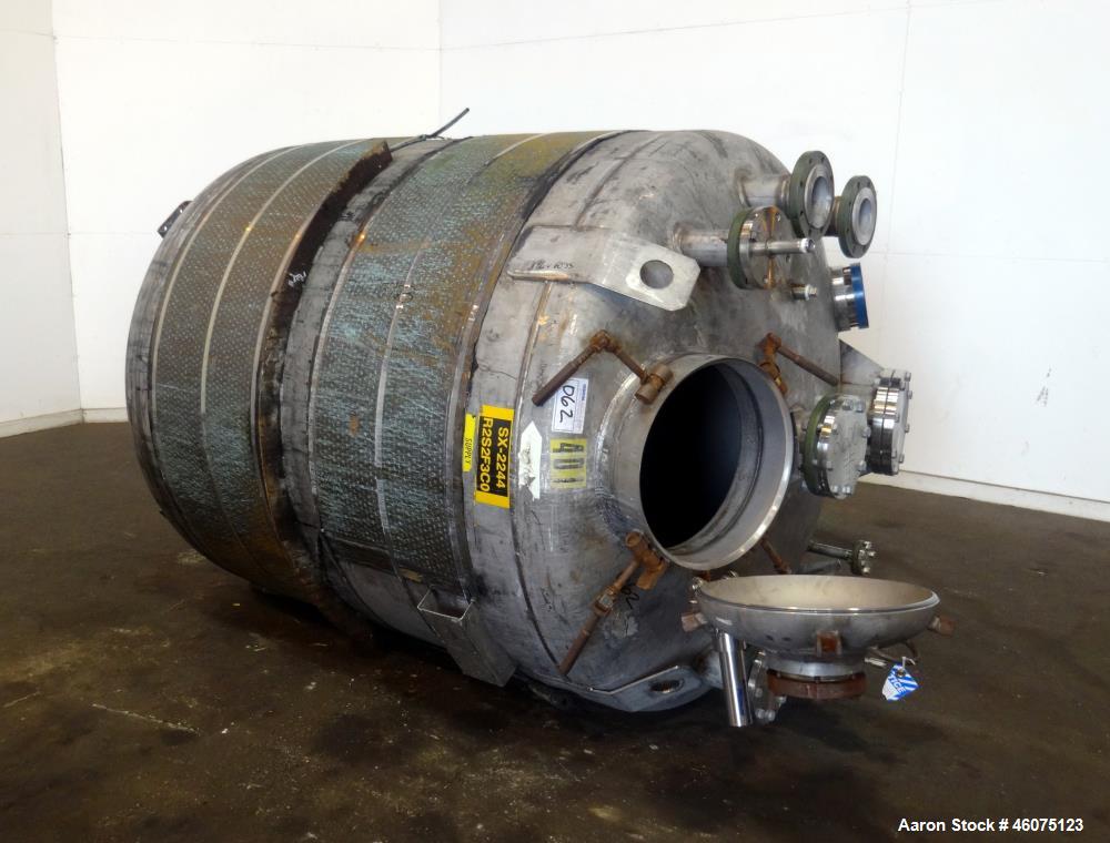 Used Tank, 950 Gallon, 316 Stainless Steel, Vertical. Approximate 64" diameter x 60" straight side, dished top & bottom. Openings top: 20" man way with hinged cover, (1) 8", (1) 6", (1) 6" sight glas...