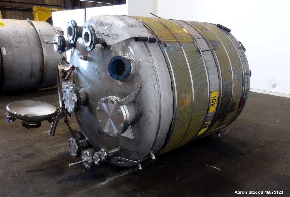Used Tank, 950 Gallon, 316 Stainless Steel, Vertical. Approximate 64" diameter x 60" straight side, dished top & bottom. Openings top: 20" man way with hinged cover, (1) 8", (1) 6", (1) 6" sight glas...
