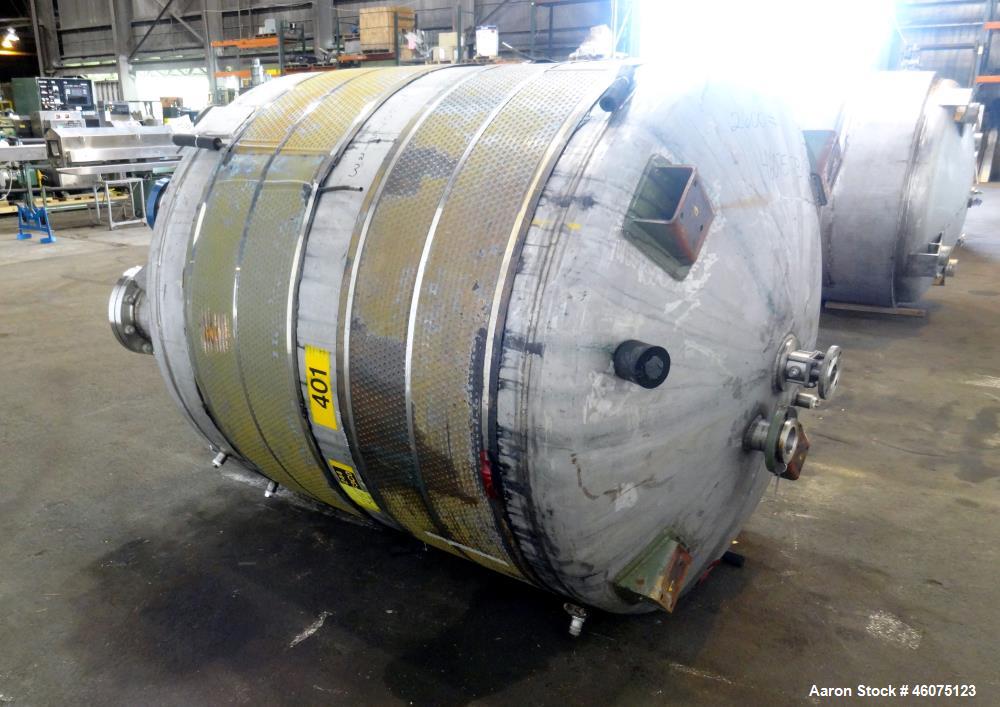 Used Tank, 950 Gallon, 316 Stainless Steel, Vertical. Approximate 64" diameter x 60" straight side, dished top & bottom. Openings top: 20" man way with hinged cover, (1) 8", (1) 6", (1) 6" sight glas...