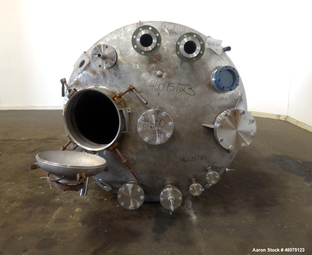 Used Tank, 950 Gallon, 316 Stainless Steel, Vertical. Approximate 64" diameter x 60" straight side, dished top & bottom. Openings top: 20" man way with hinged cover, (1) 8", (1) 6", (1) 6" sight glas...