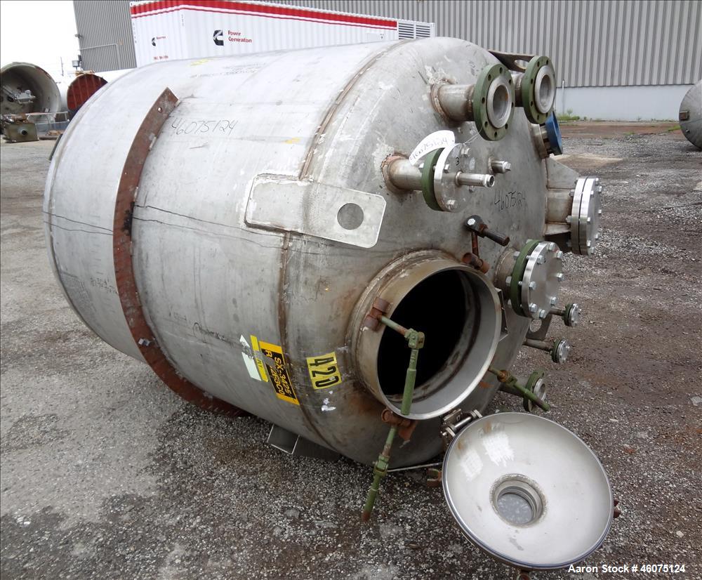Used Tank, 975 Gallon, 316 Stainless Steel, Vertical. Approximate 66" diameter x 60" straight side, dished top/bottom. Top openings: (2) 3", (2) 1", (3) 4", 6", 6" sight glass, 8", 20" manway with co...