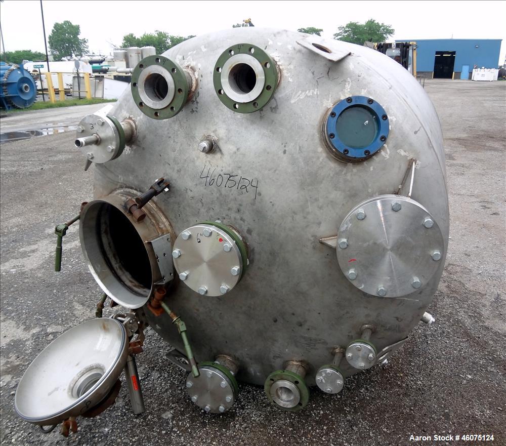 Used Tank, 975 Gallon, 316 Stainless Steel, Vertical. Approximate 66" diameter x 60" straight side, dished top/bottom. Top openings: (2) 3", (2) 1", (3) 4", 6", 6" sight glass, 8", 20" manway with co...