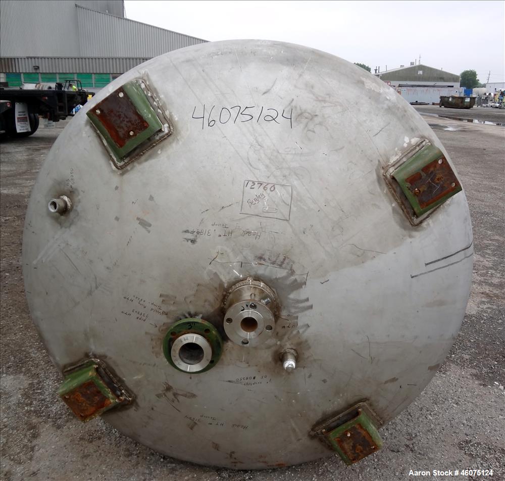 Used Tank, 975 Gallon, 316 Stainless Steel, Vertical. Approximate 66" diameter x 60" straight side, dished top/bottom. Top openings: (2) 3", (2) 1", (3) 4", 6", 6" sight glass, 8", 20" manway with co...