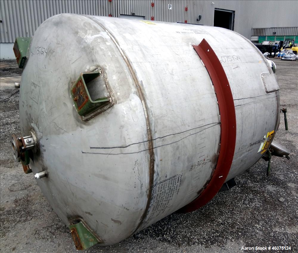 Used Tank, 975 Gallon, 316 Stainless Steel, Vertical. Approximate 66" diameter x 60" straight side, dished top/bottom. Top openings: (2) 3", (2) 1", (3) 4", 6", 6" sight glass, 8", 20" manway with co...