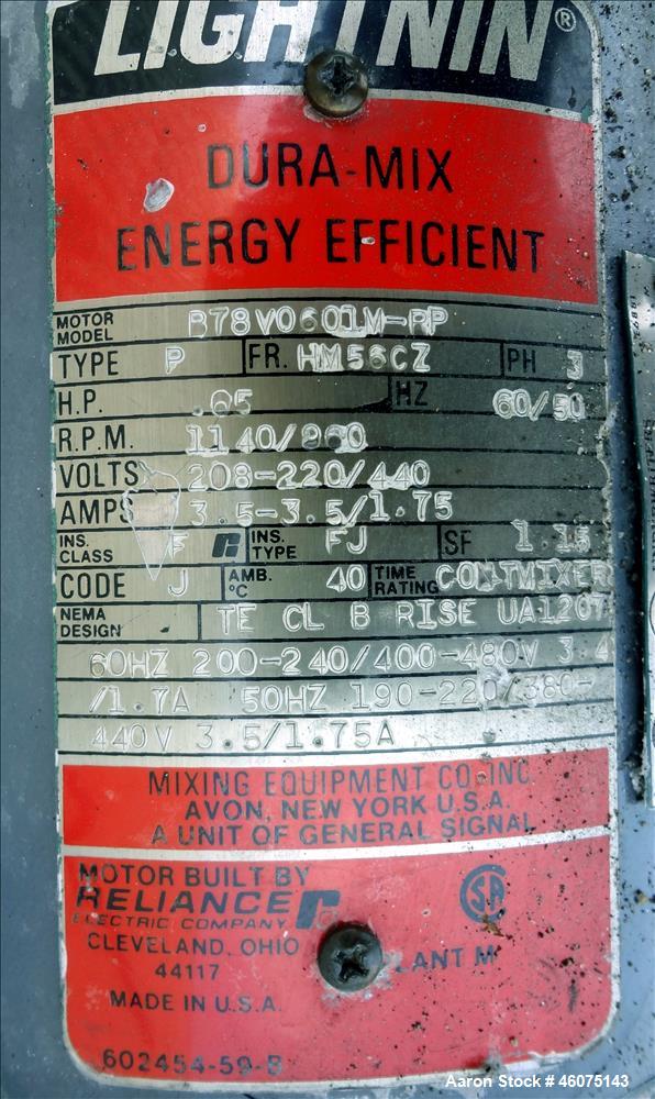 Used Tank, 500 Gallon, 304 Stainless Steel, Vertical. Approximate 48" diameter x 60" straight side, dished top & bottom. Off center top entering Lightnin agitator serial number 88/363017-03. Shaft an...