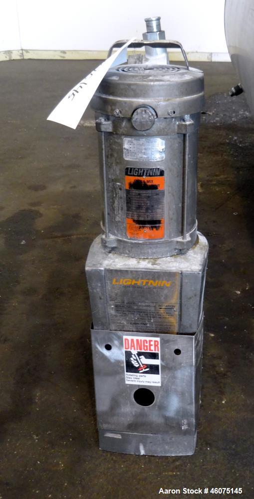 Used Tank, 500 Gallon, 304 Stainless Steel, Vertical. Approximate 48" diameter x 60" straight side, dished top and bottom. Off center top entering Lightnin agitator, model EKXJSS-117, serial# 97/0125...