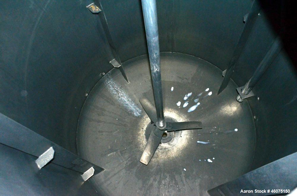 Used Tank, 800 Gallon, 304 Stainless Steel, Vertical. Approximate 60" diameter x 60" straight side, dished top & bottom. Top entering Lightnin agitator, model 71-C-3, serial# 7900275, ratio 9.33 to 1...