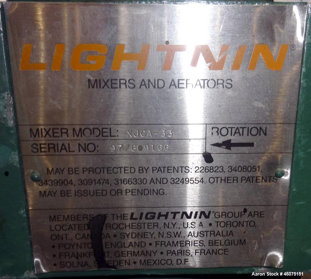 Used Tank, 500 Gallon, 304 Stainless Steel, Vertical. Approximate 48" diameter x 60" straight side, dished top and bottom. Off center top entering Lightnin agitator, model XJCA-33, serial# 97/G09166....