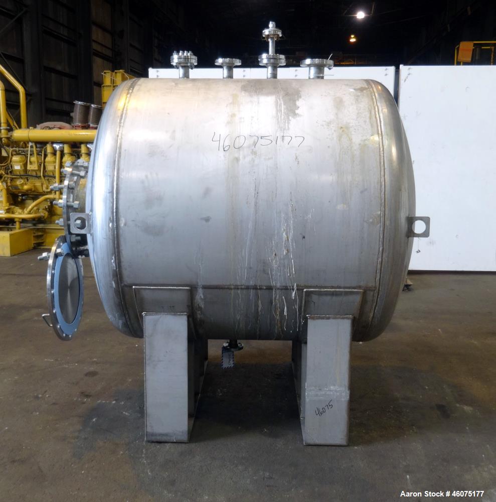 Used Tank, 700 Gallon, 316 Stainless Steel, Horizontal. Approximate 60" diameter x 49" straight side, dished ends. Openings Top: (1) 3", (3) 2". Side: 16" man way with cover. 1-1/2" Center bottom out...