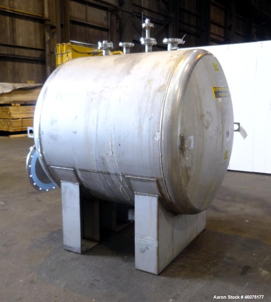 Used Tank, 700 Gallon, 316 Stainless Steel, Horizontal. Approximate 60" diameter x 49" straight side, dished ends. Openings Top: (1) 3", (3) 2". Side: 16" man way with cover. 1-1/2" Center bottom out...