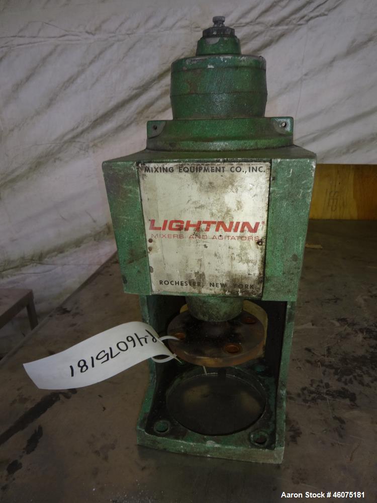 Used Tank, 775 Gallon, 316 Stainless Steel, Vertical. Approximate 60" diameter x 57" straight side, dished top & bottom. Off center top entering air operated Lightnin agitator. Shaft with 3 blade tur...