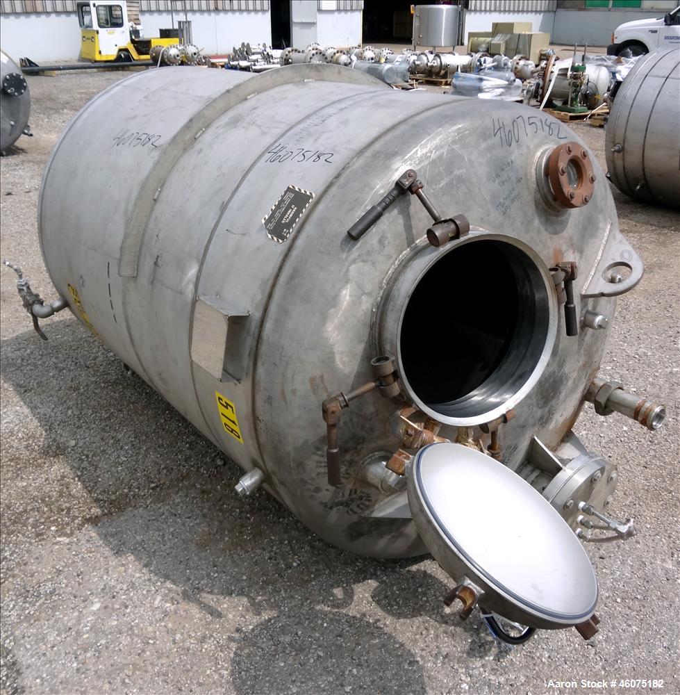 Used Tank, 500 Gallon, 304 Stainless Steel, Vertical. Approximate 48" diameter x 60" straight side, dished top & bottom. Top openings: 15" man way with cover, 8", 3", 3" sight glass, 3" center bottom...