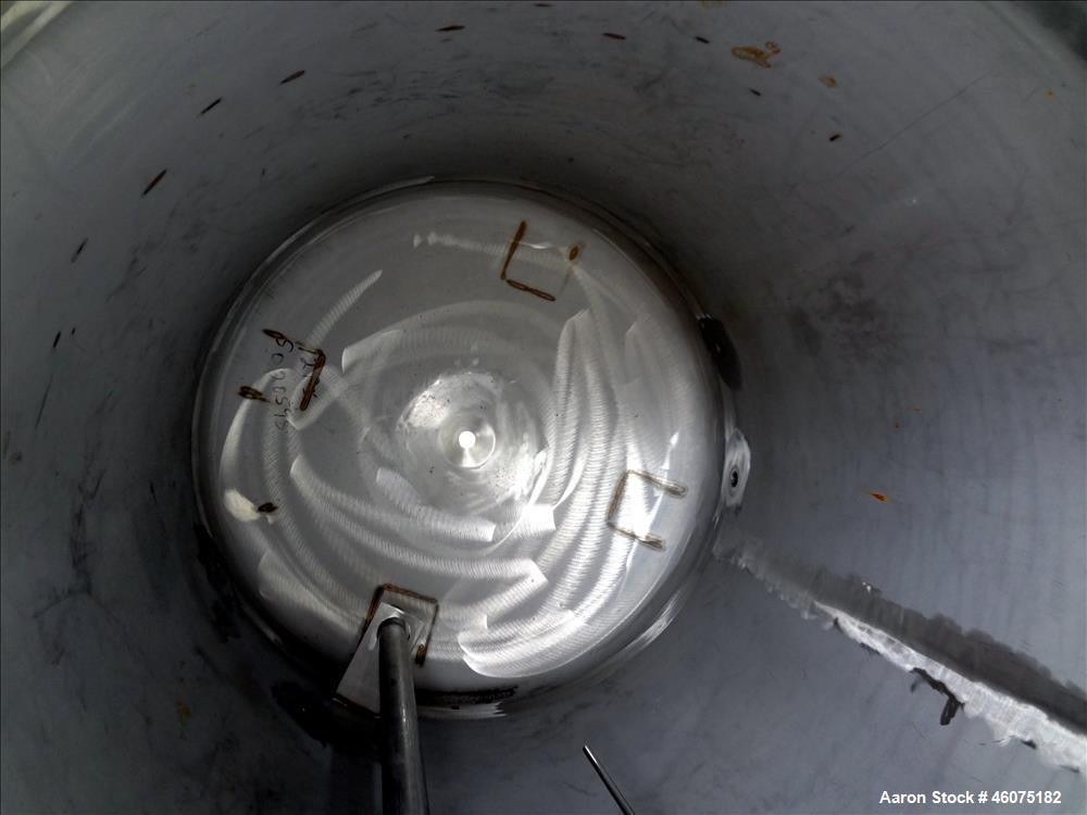 Used Tank, 500 Gallon, 304 Stainless Steel, Vertical. Approximate 48" diameter x 60" straight side, dished top & bottom. Top openings: 15" man way with cover, 8", 3", 3" sight glass, 3" center bottom...