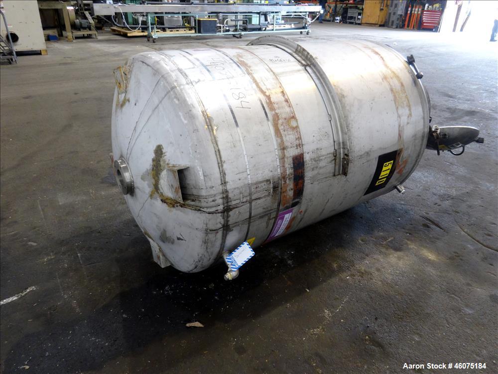 Used Tank, 500 Gallon, 304 Stainless Steel, Vertical. Approximate 48" diameter x 60" straight side, dished top and bottom. Openings Top: 18" man way with hinged cover, (1) 8", (1) 4-1/2", (3) 2". 3-1...