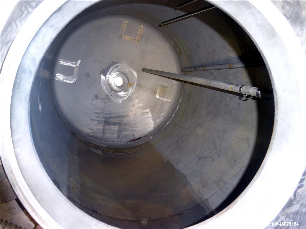 Used Tank, 500 Gallon, 304 Stainless Steel, Vertical. Approximate 48" diameter x 60" straight side, dished top and bottom. Openings Top: 18" man way with hinged cover, (1) 8", (1) 4-1/2", (3) 2". 3-1...