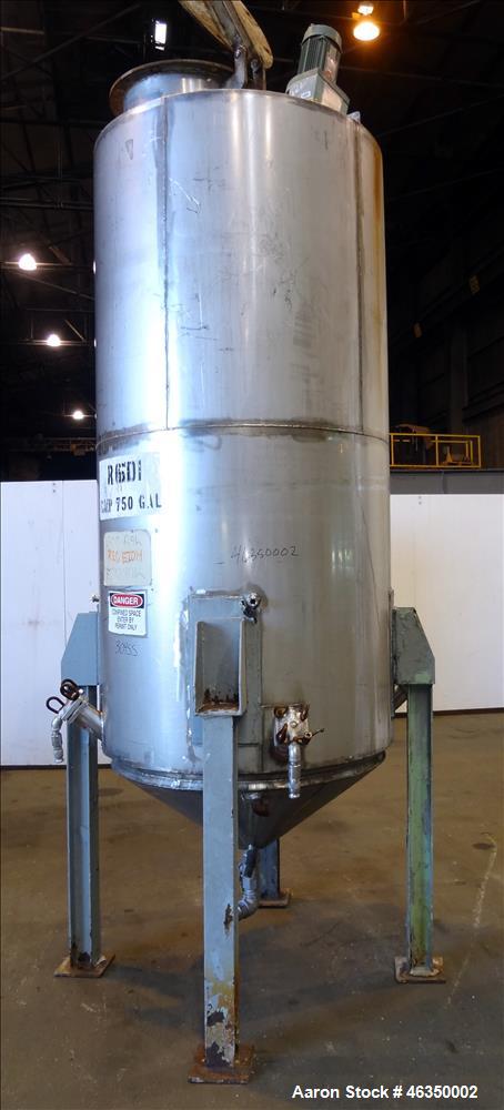 Used Tank, Approximately 750 Gallons, 304 Stainless Steel, Vertical. Approximately 48" diameter x 96" straight side. Dish top, jacketed 20" cone bottom, no rating. Top mounted off center Lightnin agi...