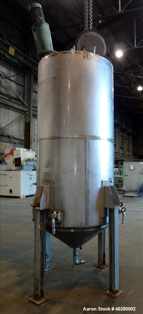 Used Tank, Approximately 750 Gallons, 304 Stainless Steel, Vertical. Approximately 48" diameter x 96" straight side. Dish top, jacketed 20" cone bottom, no rating. Top mounted off center Lightnin agi...