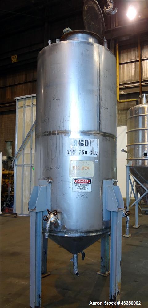 Used Tank, Approximately 750 Gallons, 304 Stainless Steel, Vertical. Approximately 48" diameter x 96" straight side. Dish top, jacketed 20" cone bottom, no rating. Top mounted off center Lightnin agi...