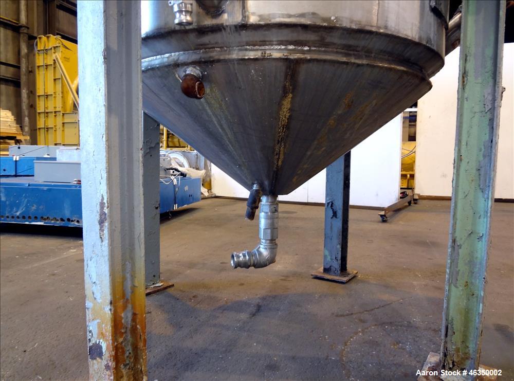 Used Tank, Approximately 750 Gallons, 304 Stainless Steel, Vertical. Approximately 48" diameter x 96" straight side. Dish top, jacketed 20" cone bottom, no rating. Top mounted off center Lightnin agi...