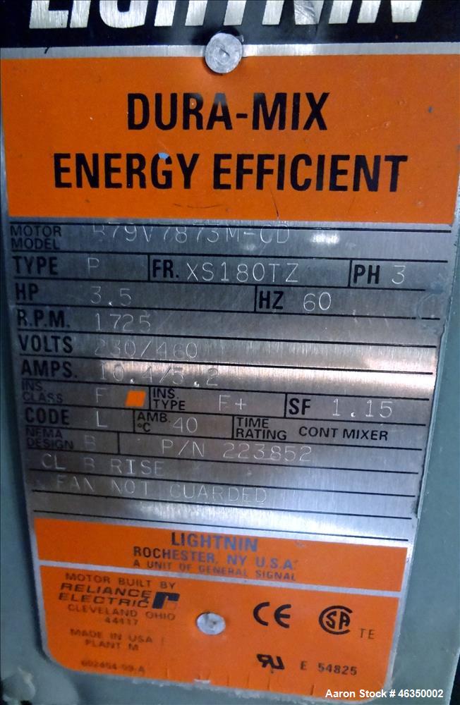 Used Tank, Approximately 750 Gallons, 304 Stainless Steel, Vertical. Approximately 48" diameter x 96" straight side. Dish top, jacketed 20" cone bottom, no rating. Top mounted off center Lightnin agi...