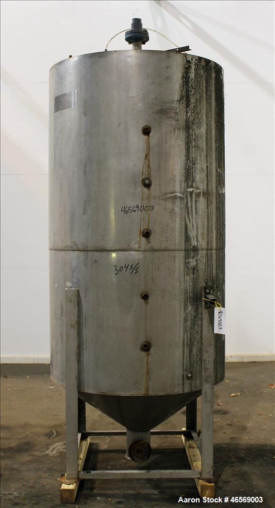 Used Tank, Approximate 700 Gallon, 304 Stainless Steel, Vertical. 48" Diameter x 82" straight side. Flat welded top, cone bottom. Openings Top: (1) 18", (2) 2". Side (1) 4", (5) 1". 2" Center bottom ...