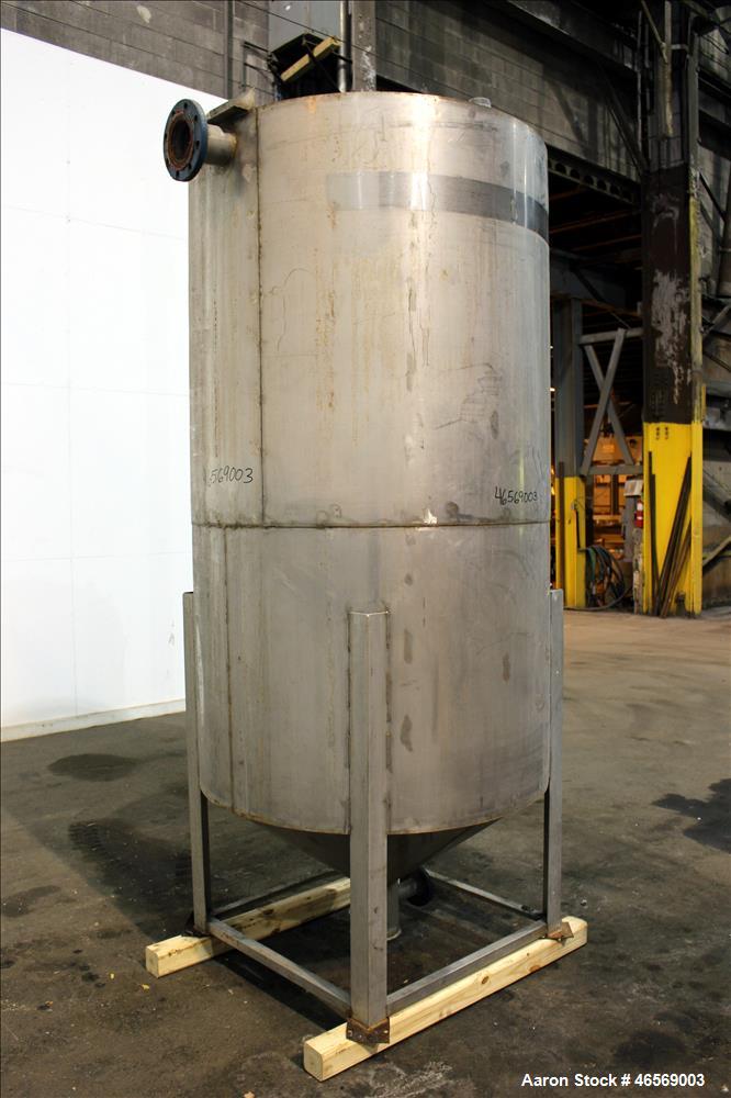 Used Tank, Approximate 700 Gallon, 304 Stainless Steel, Vertical. 48" Diameter x 82" straight side. Flat welded top, cone bottom. Openings Top: (1) 18", (2) 2". Side (1) 4", (5) 1". 2" Center bottom ...