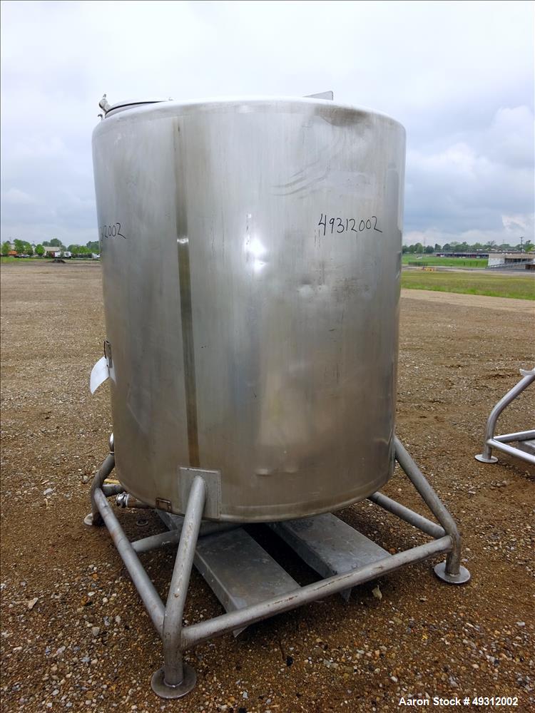 Used Tank, 500 Gallon, Stainless Steel, Vertical. Approximate 52" diameter x 54" straight side, flet top, coned bottom. Openings top 20" manway with cover, 4", side bottom 3", approximate 2" tangenti...